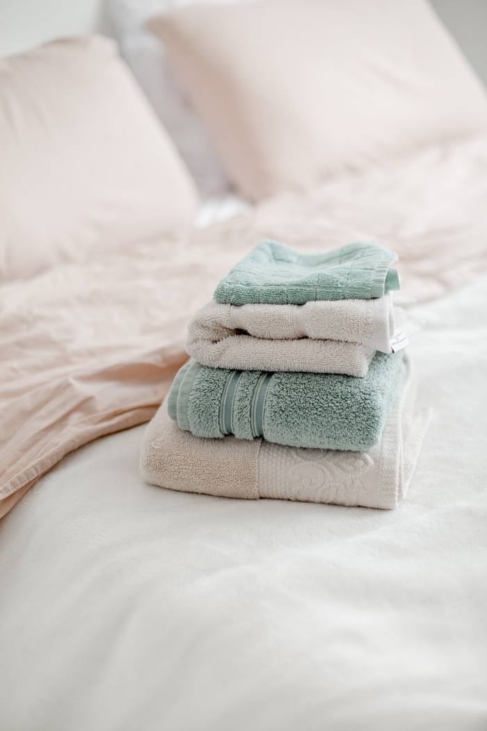 Neatly folded towels prepared for a holiday home turnover clean